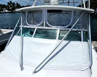 Custom clear vinyl enclosure and canvas top on a boat