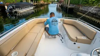 Villegas Brothers technician installing custom marine upholstery